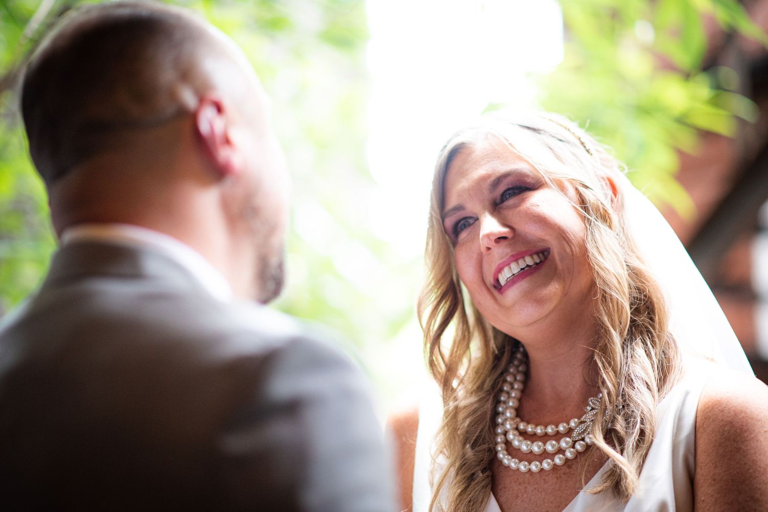 Bride and groom smiling first look wedding day