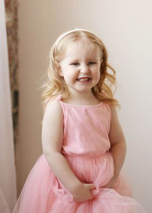 Playful poses and movements captured in a pink tulle dress.