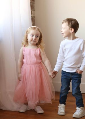 Series of candid moments showing dancing and interaction in pink dress and casual wear.