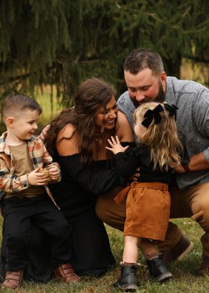 A playful family moment captured in a sequence of photos outdoors.