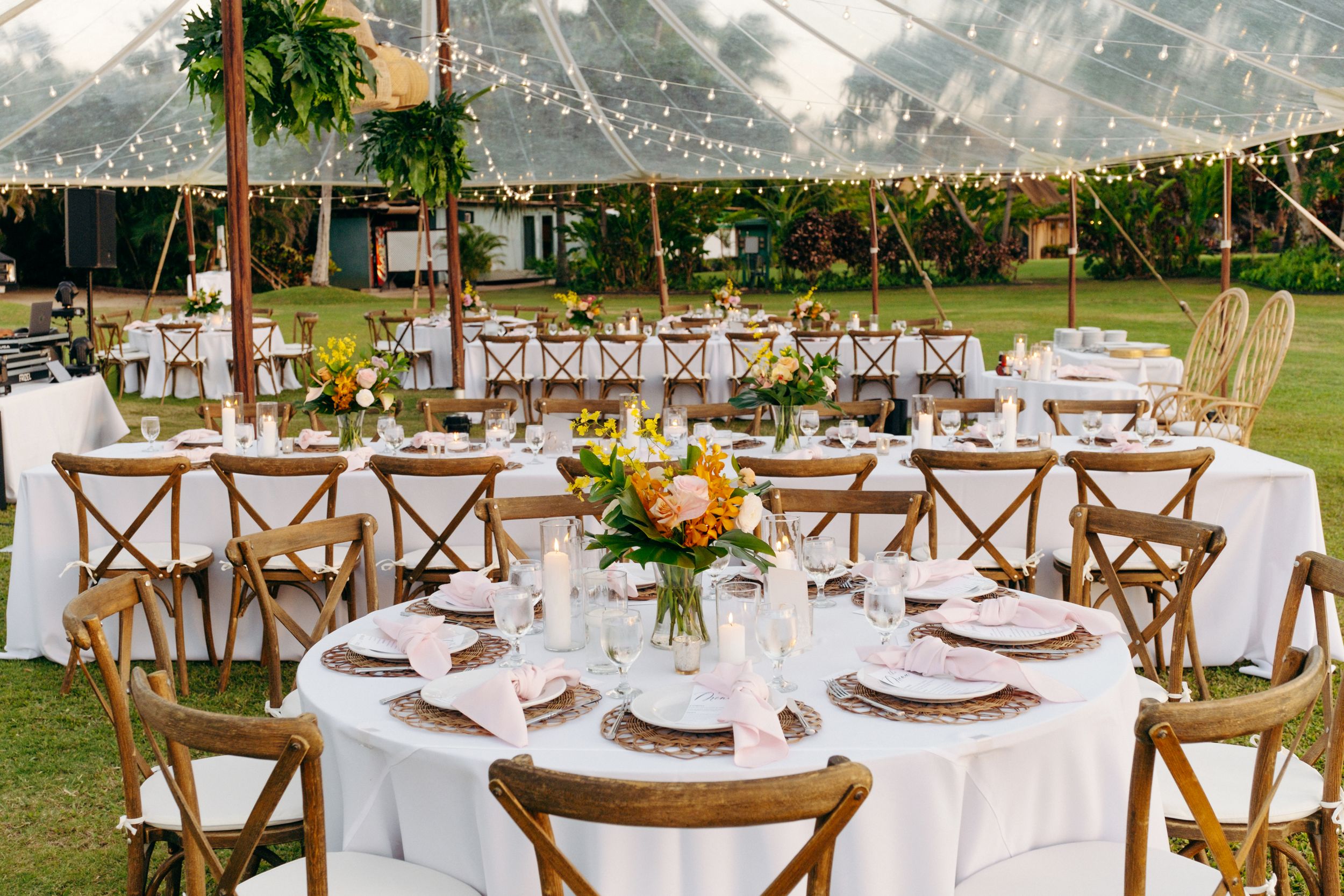 Elegant wedding reception tables under a clear tent at Lanikuhonua, Ko Olina, Oahu – luxury wedding decor photography.
