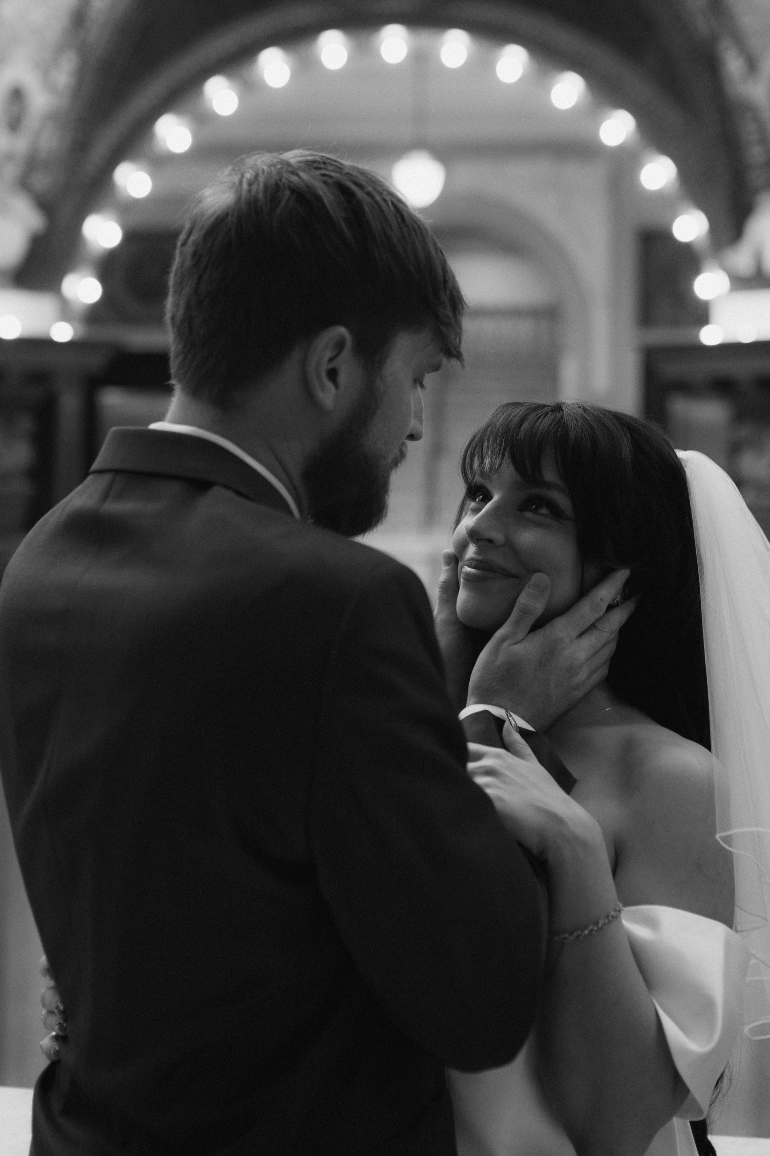 Black and white sequence of romantic wedding moments under string lights.
