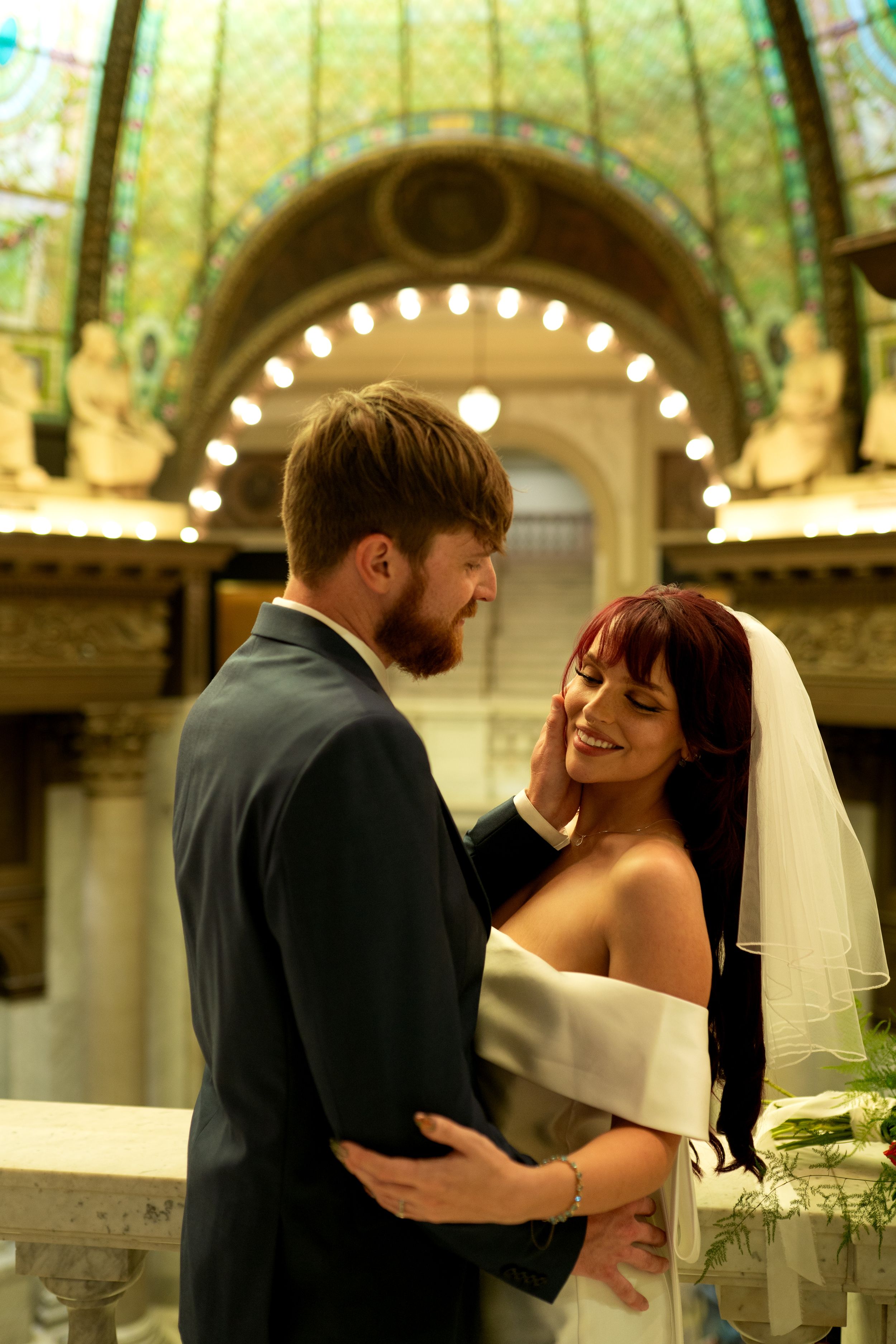 Tender wedding moments captured in sequence under decorative domed ceiling.