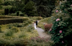 beautiful candid and cinematic photo with bride and groom in a beautiful garden