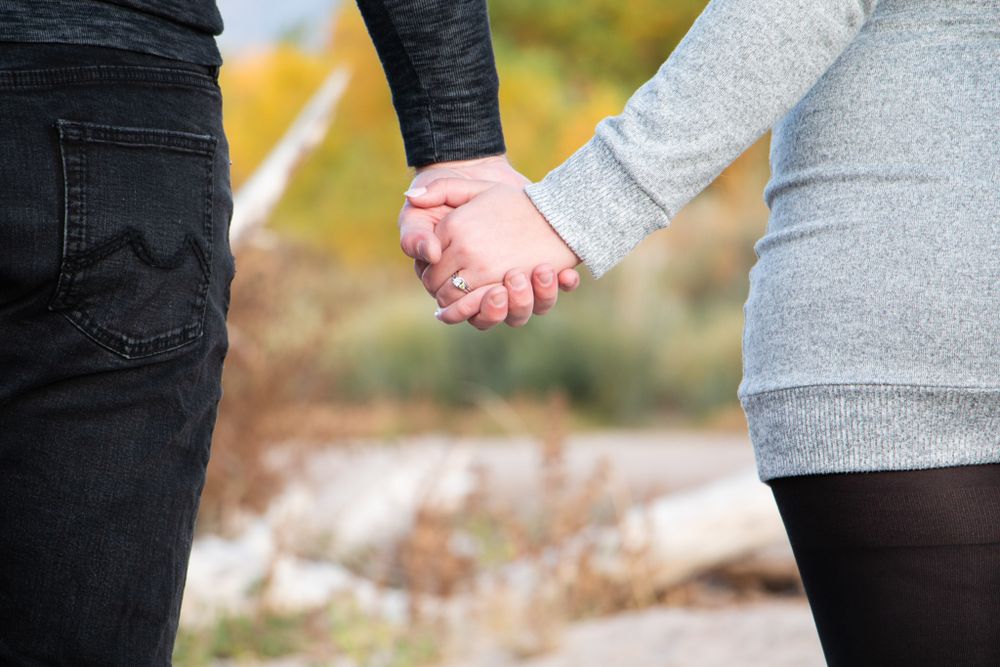 Engagement Portrait Session with ring and holding hands