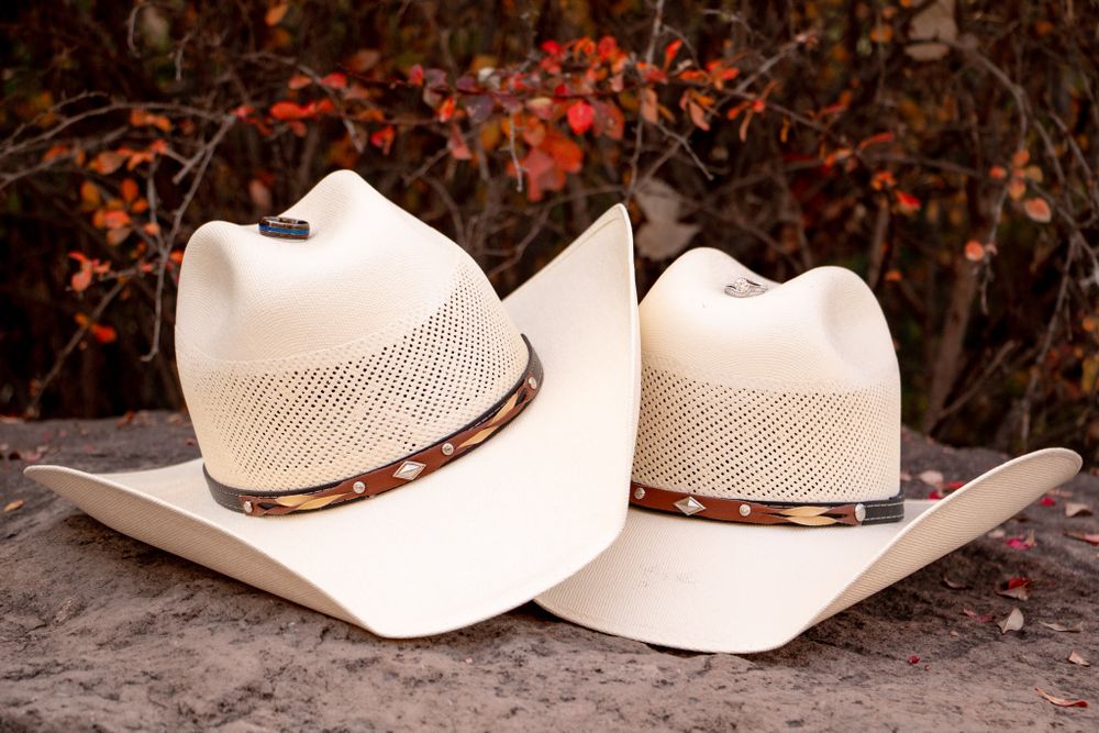 Engagement Photography and rings with cowboy hats in New Mexico