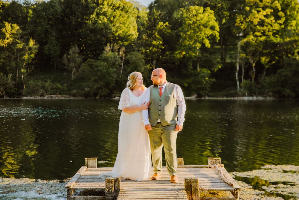 wedding couple on lake at Fonthill Estate Wedding venue near Salisbury. Wiltshire barn venue. Wiltshire wedding venue near lake.