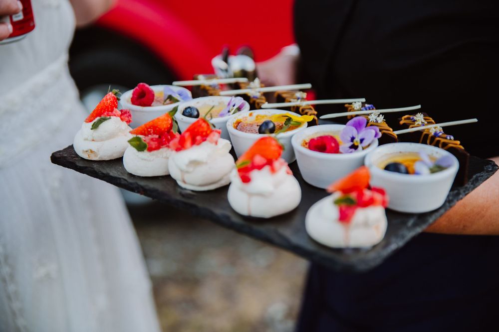 Bright coloured puddings served at Fonthill Estate Deer Park barn. Documemtary Wedding photographer Hampshire and Wiltshire