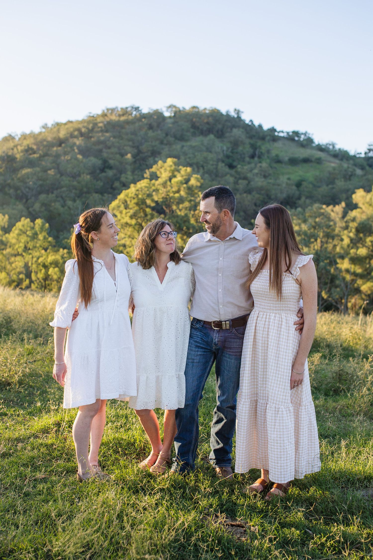 Family smiling at eachother during Scone family photoshoot