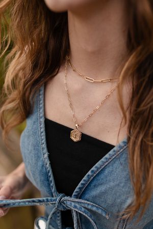 Detail shot of gold chain necklace with denim jacket outfit. Senior photo session. Lake Geneva Wisconsin Photographer