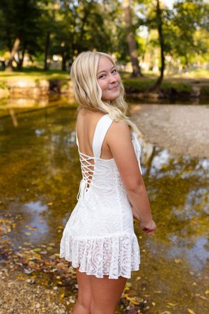 White lace summer top shown from multiple angles near water's edge. Senior photo session. Lake Geneva Wisconsin Photographer