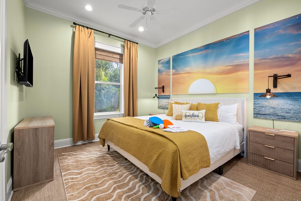 A panoramic collage of modern bedrooms in a vacation rental property showcasing different angles and lighting designs.