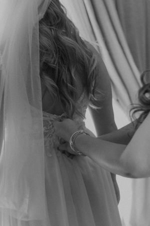Ethereal black and white photo featuring flowing white fabric and soft lighting.