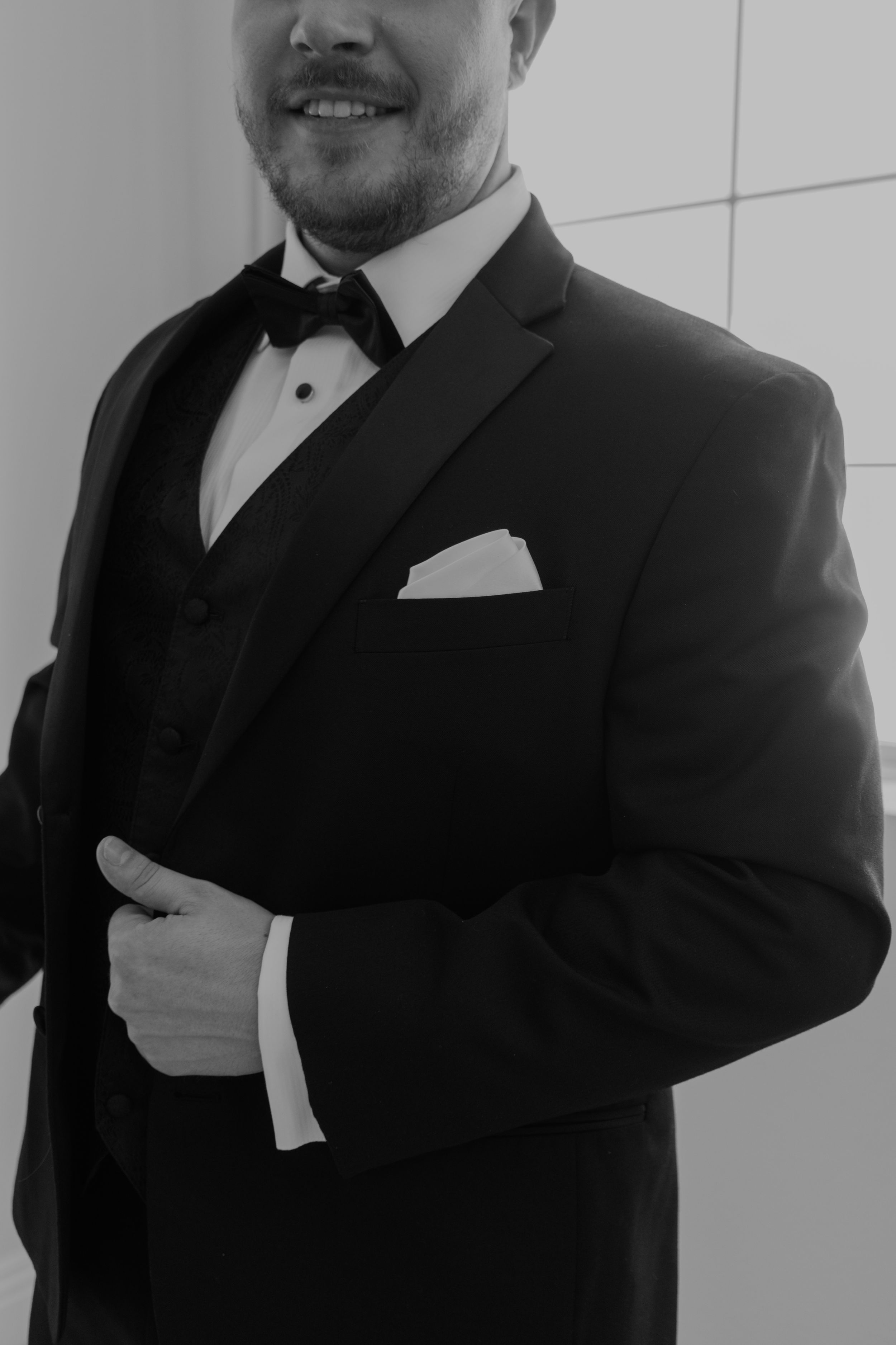 A series of black and white portraits showing someone in a formal tuxedo with a bow tie.