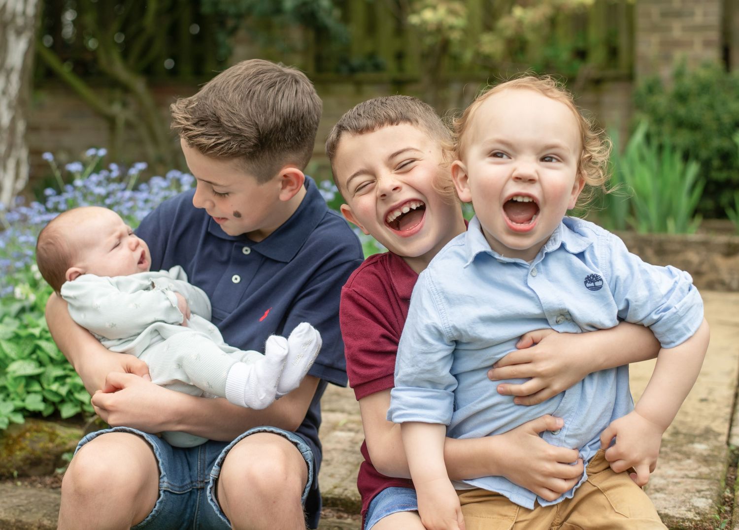 Brothers and sister playing and laughing