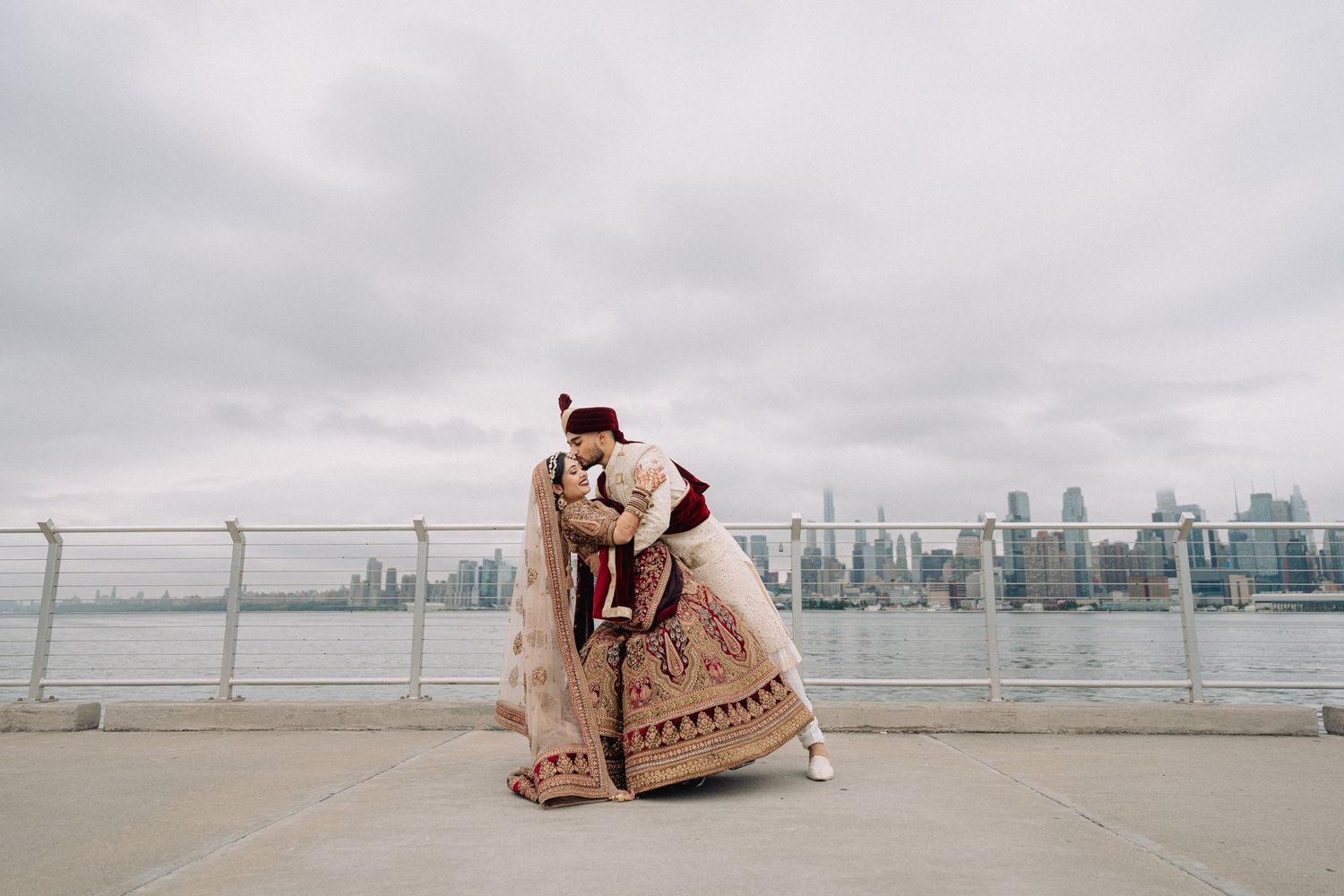 Scenic rooftop wedding venue with city skyline view and elegant seating arrangement.