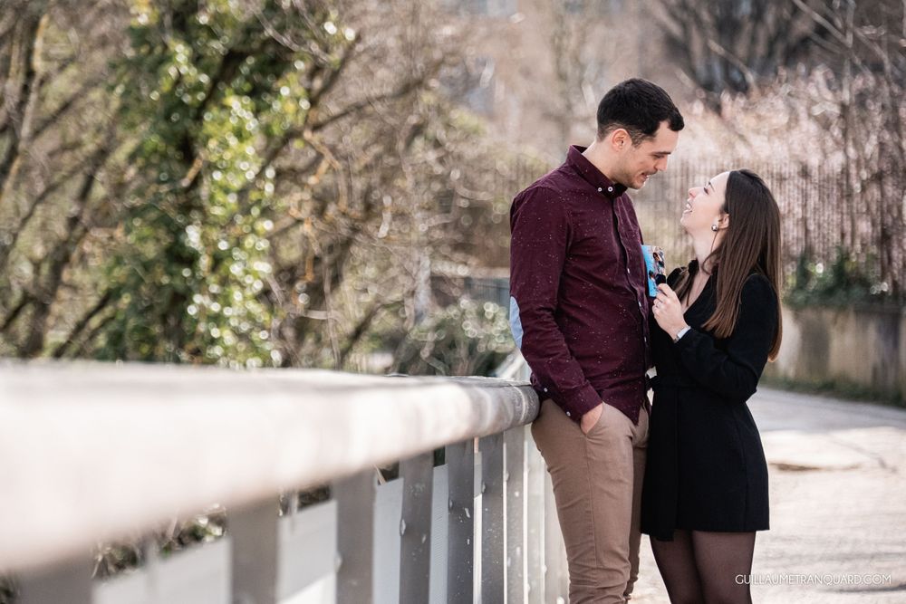 Intimate outdoor photoshoot in a garden pathway setting.