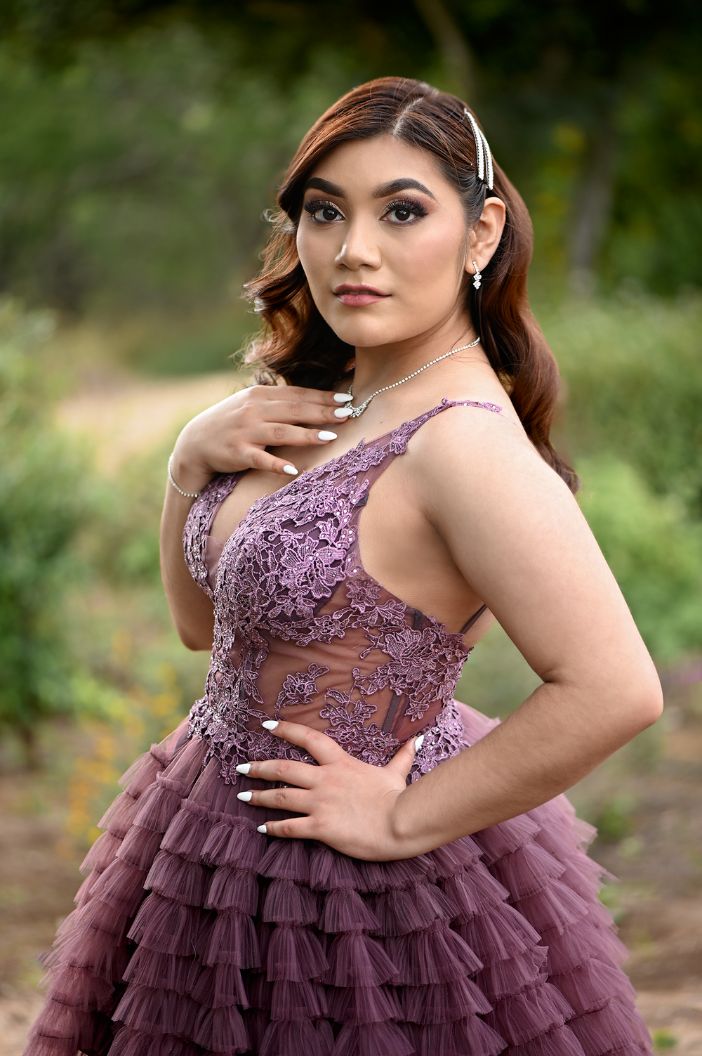 Detailed view of mauve evening gown with beaded lace bodice and tiered tulle skirt.