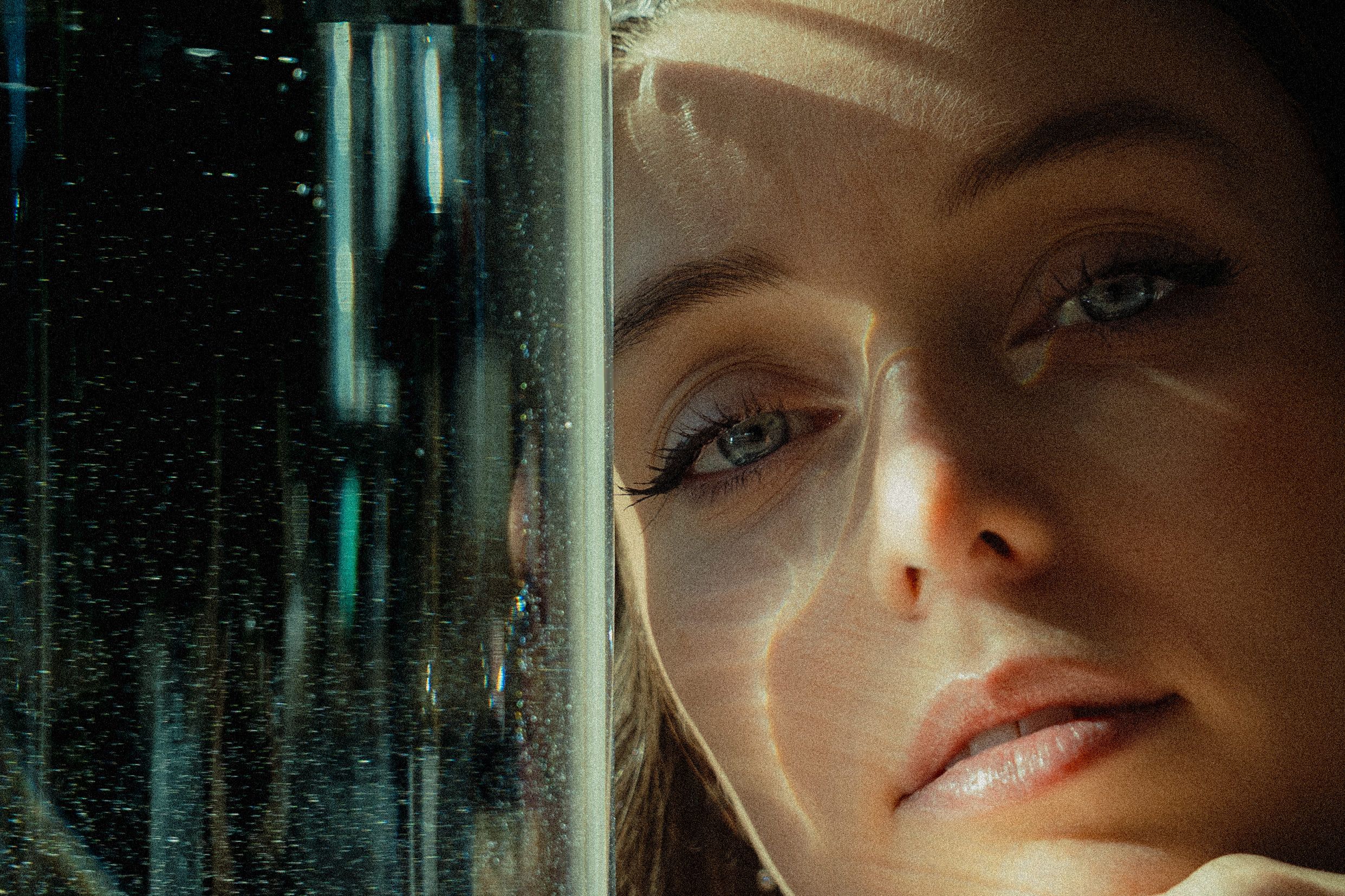 Cinematic portraits with teal lighting effects creating dramatic urban atmosphere.