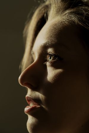 Artistic profile portraits with soft side lighting creating delicate shadows and highlights.
