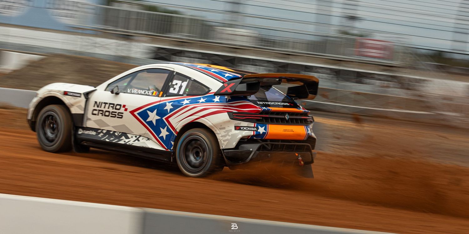 White Dodge Hornet kicking up dust while drifting at Nitrocross 2024