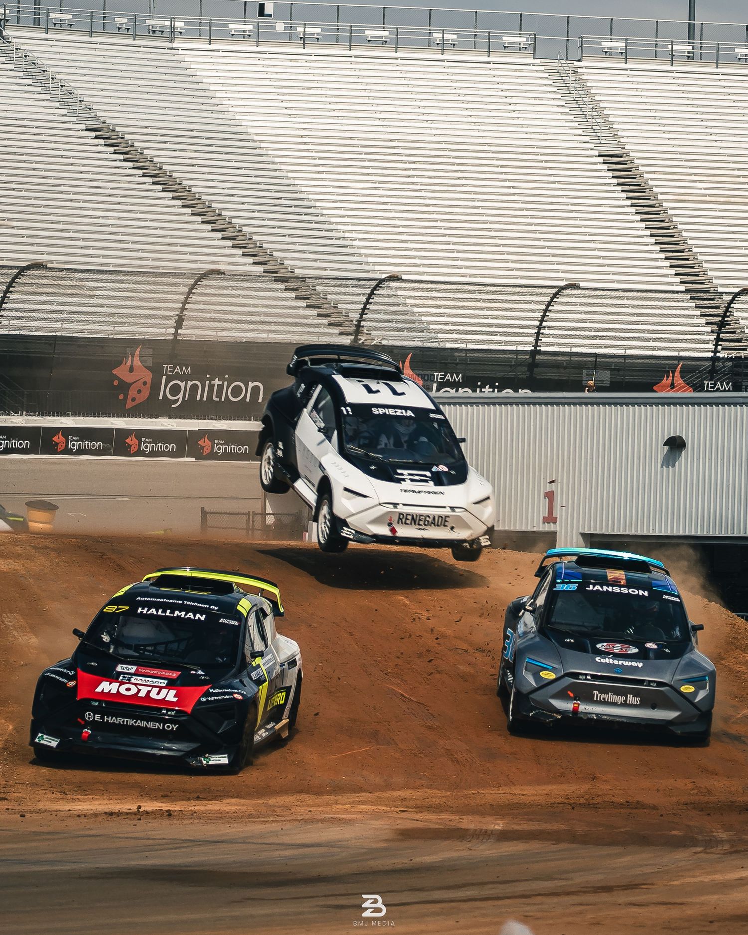 Three Dodge Hornets airborne over dirt jumps at Nitrocross 2024