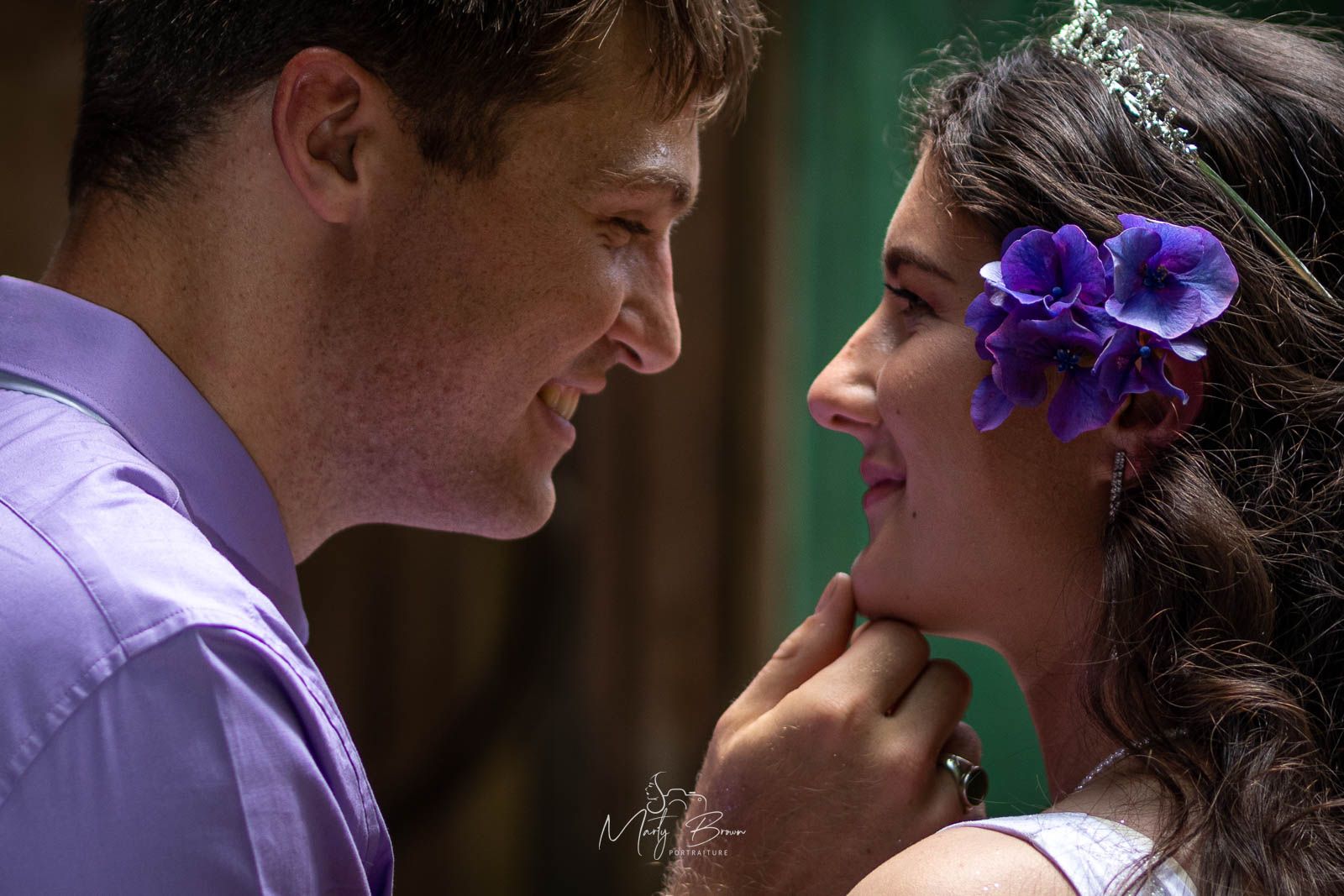 Groom gently touches Brides chin