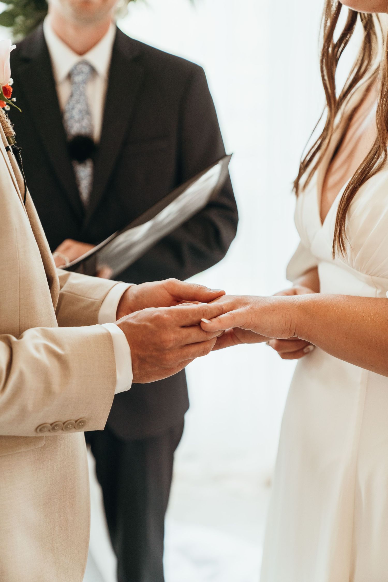 Bride and groom exchanging wedding rings. Wedding vows.