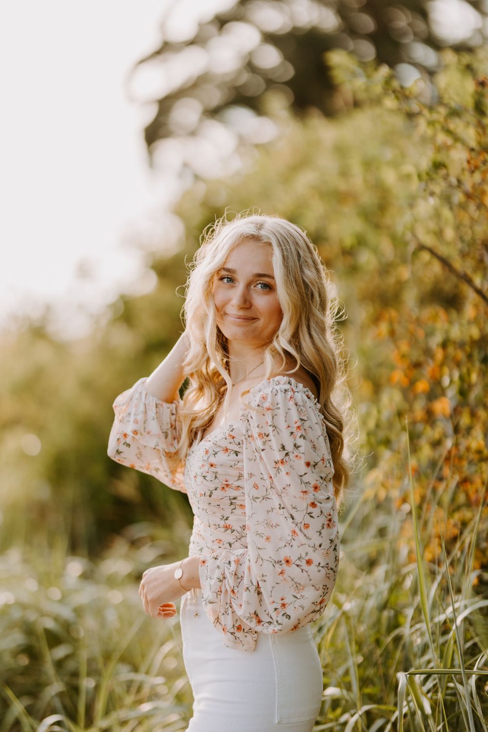 Portrait in natural setting with lace top and golden hour lighting.