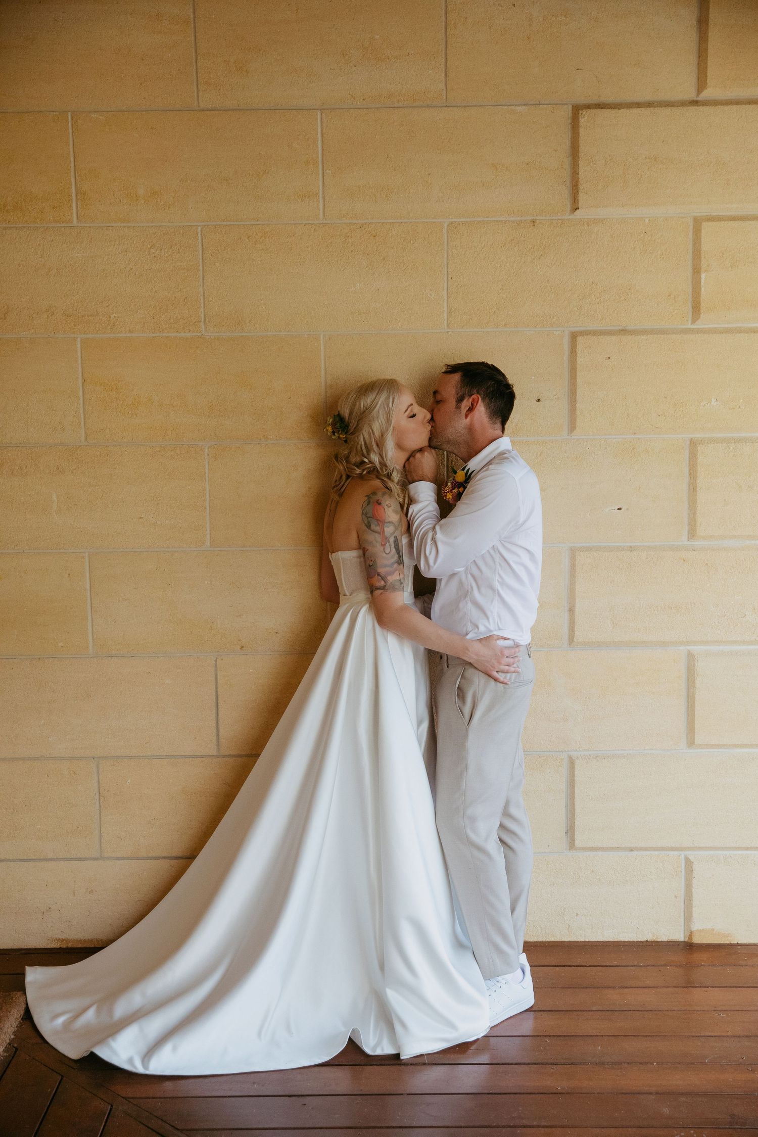 Couple kissing agains the stone wall, Waurn Ponds, Victoria