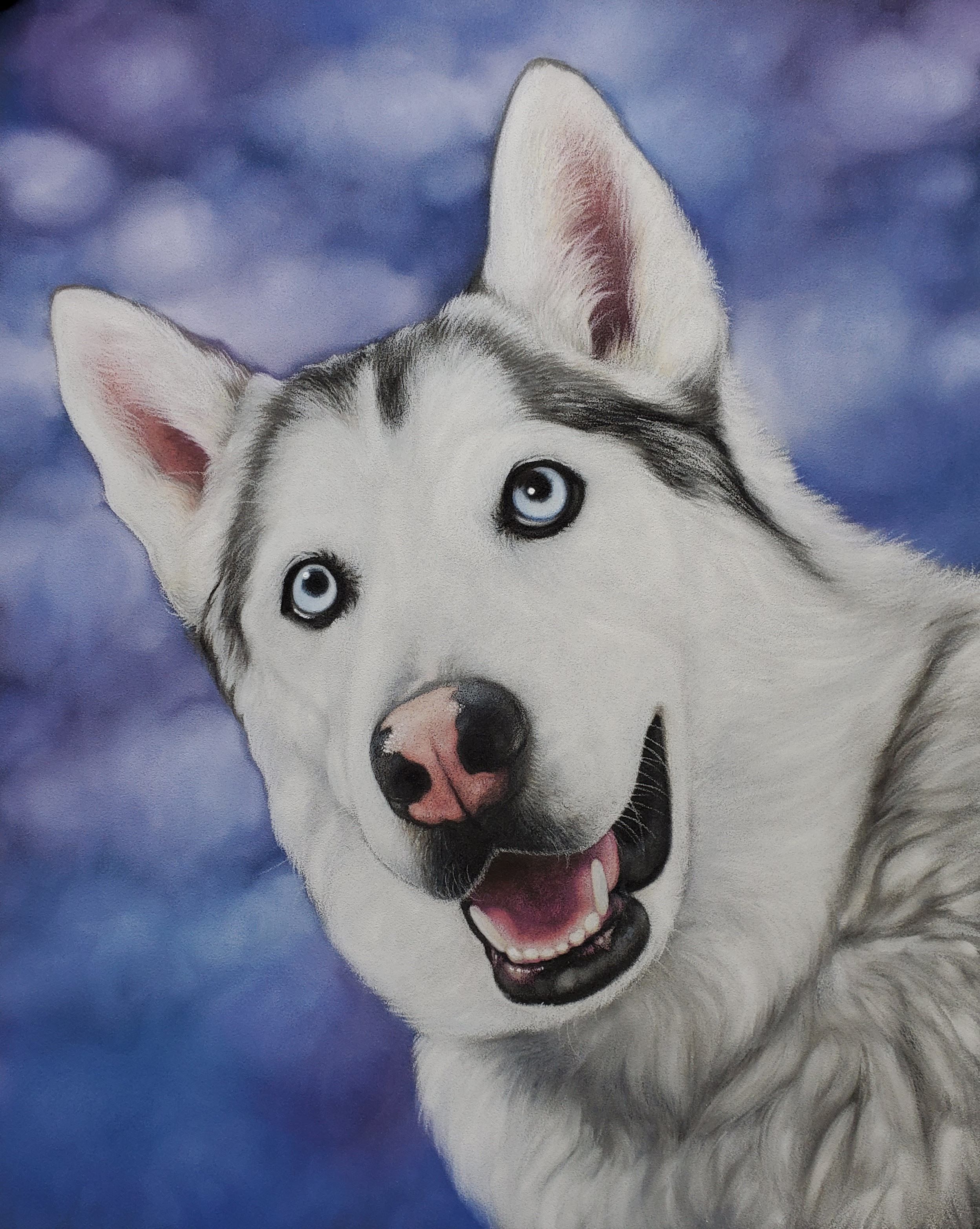 Cheerful Siberian Husky portrait with bright blue eyes and a happy expression against cloudy sky.