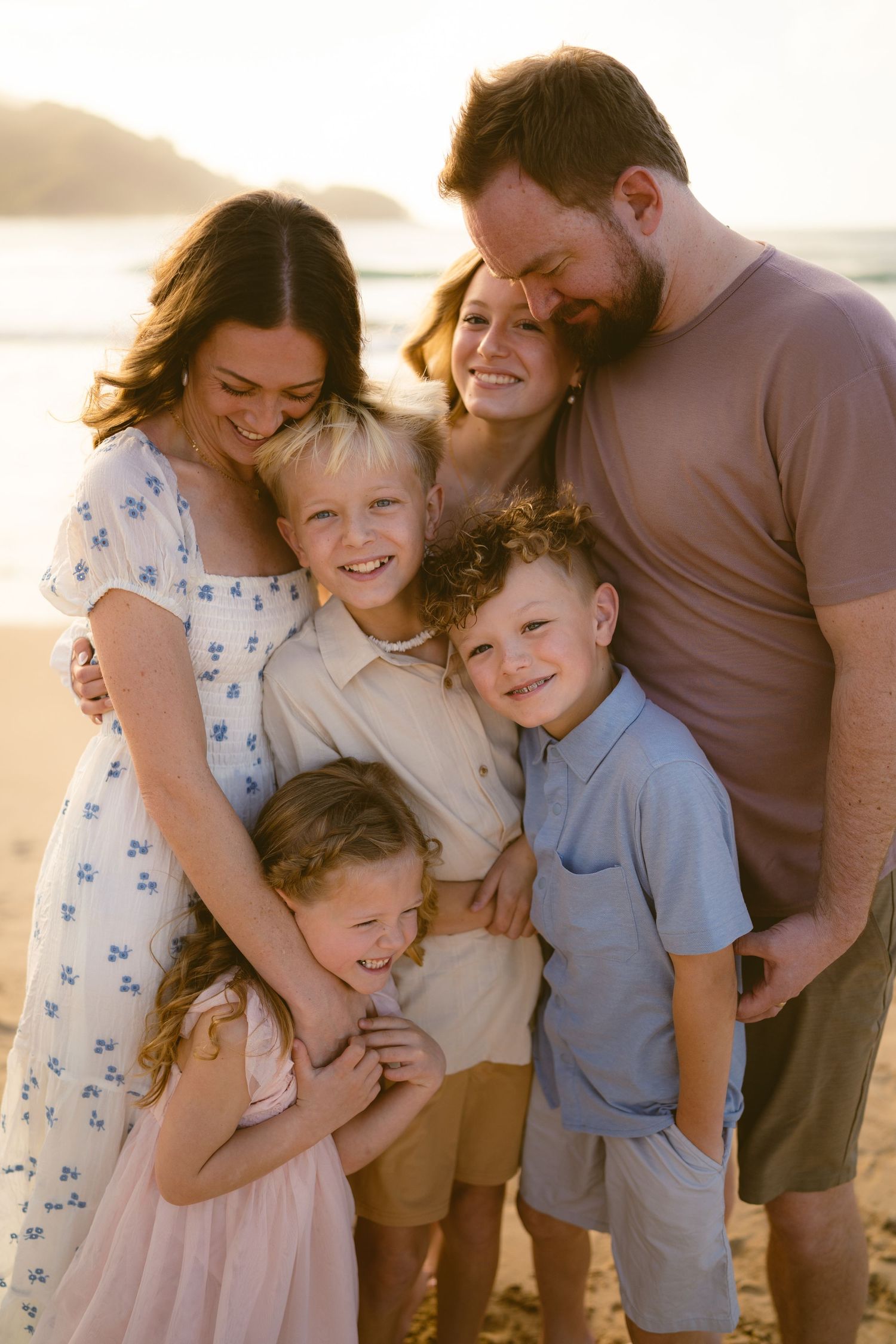 Family running at sunset on Kauai