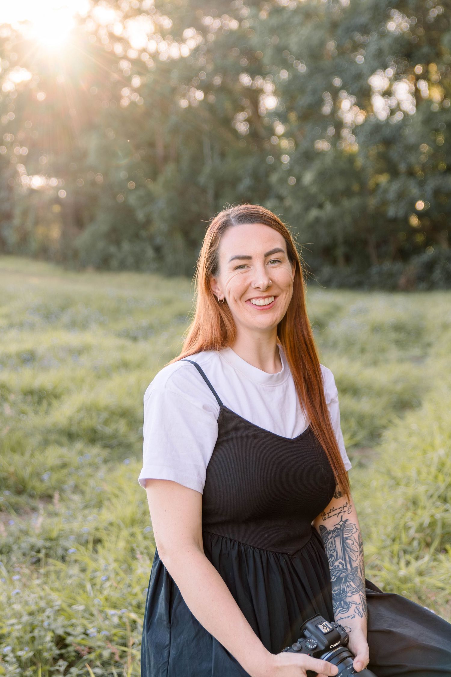 Outdoor portrait session in field during golden hour sunset.
