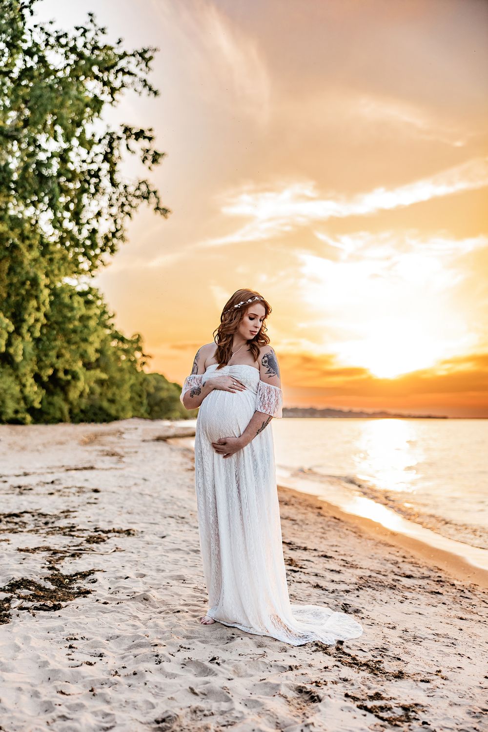 Rochester NY maternity photographer Lidia Lyakhovich Photography capturing pregnancy photos at Ontario Beach Park