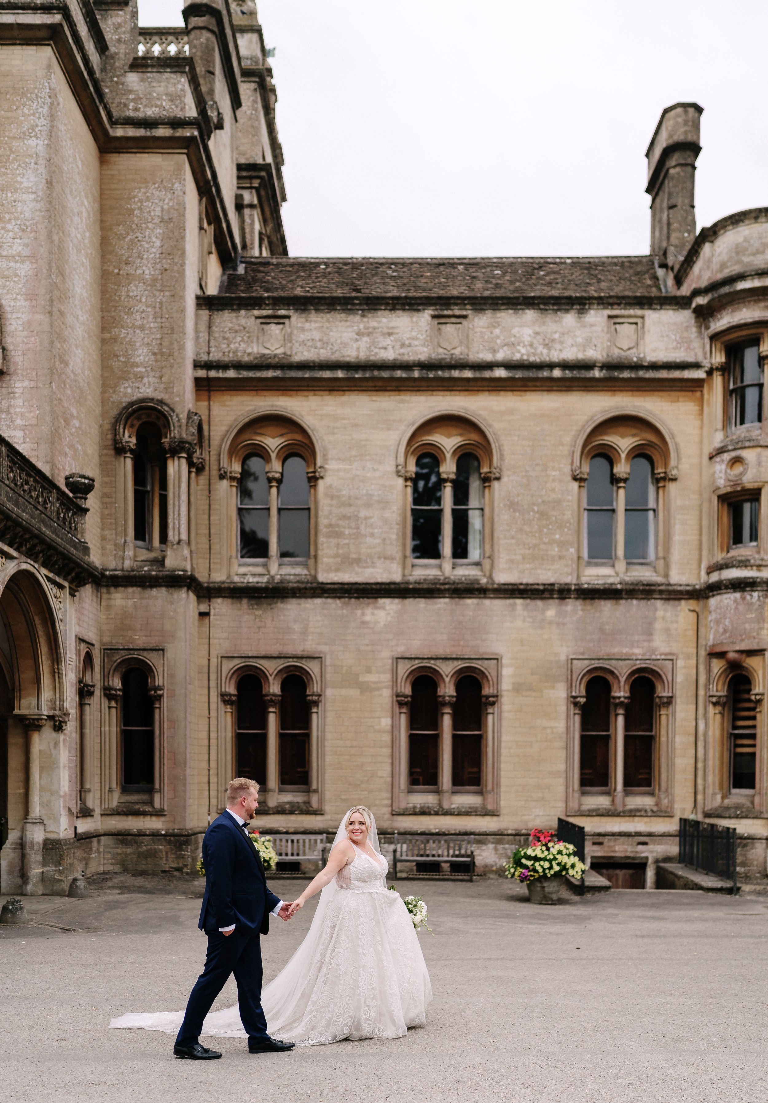 Ornate Gothic architecture of historic stone building with arched windows and decorative details.
