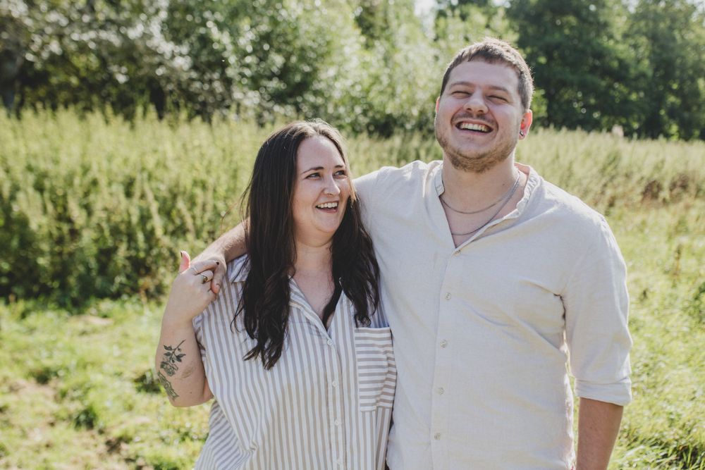 Couple sharing genuine laughter together during outdoor portrait session. 
Suffolk Couple photos. Beckie Egan Photography.