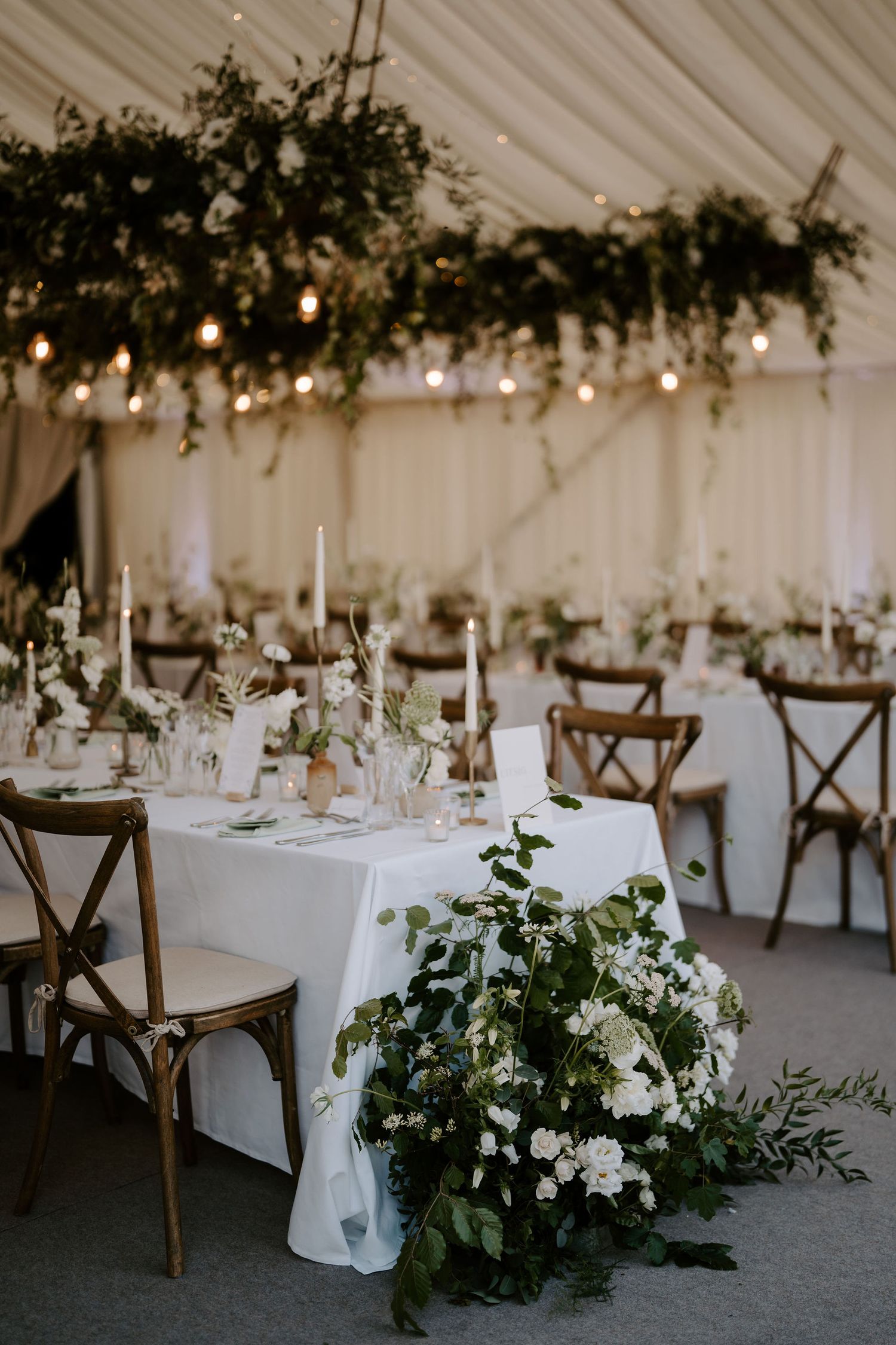 wedding flowers and candles decorating tables at hamswell house wedding in bath