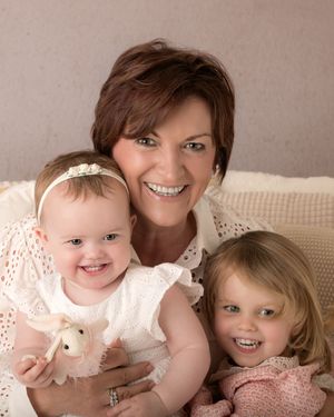A heartwarming family portrait series showing tender moments and joyful expressions between children and grandparent.