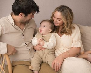 A series of intimate family photos showing tender moments between parents and baby in neutral beige tones.