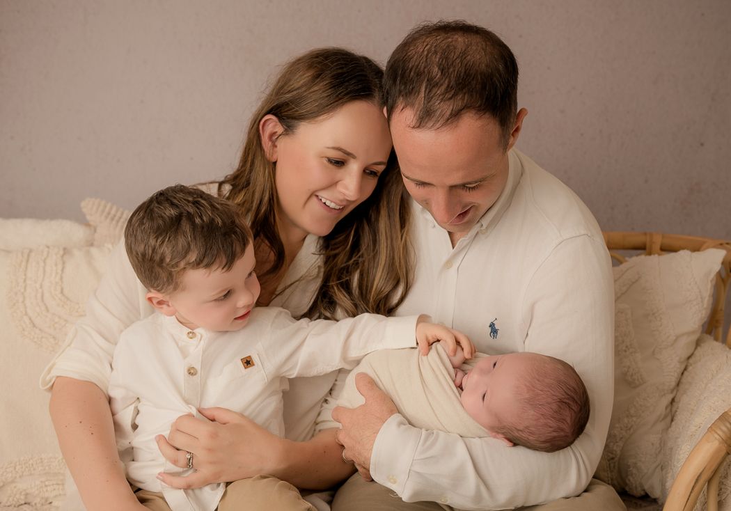 A tender family moment beautifully photographed in a relaxed lifestyle photography session.