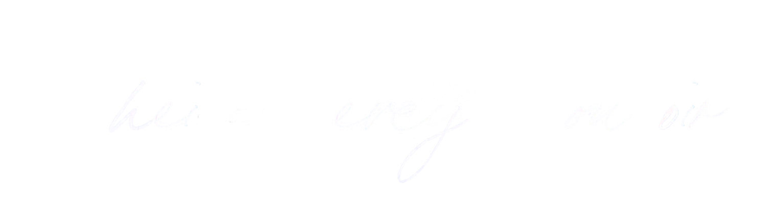 Stylized black script signature or text logo with elegant flourishes on a white background.
