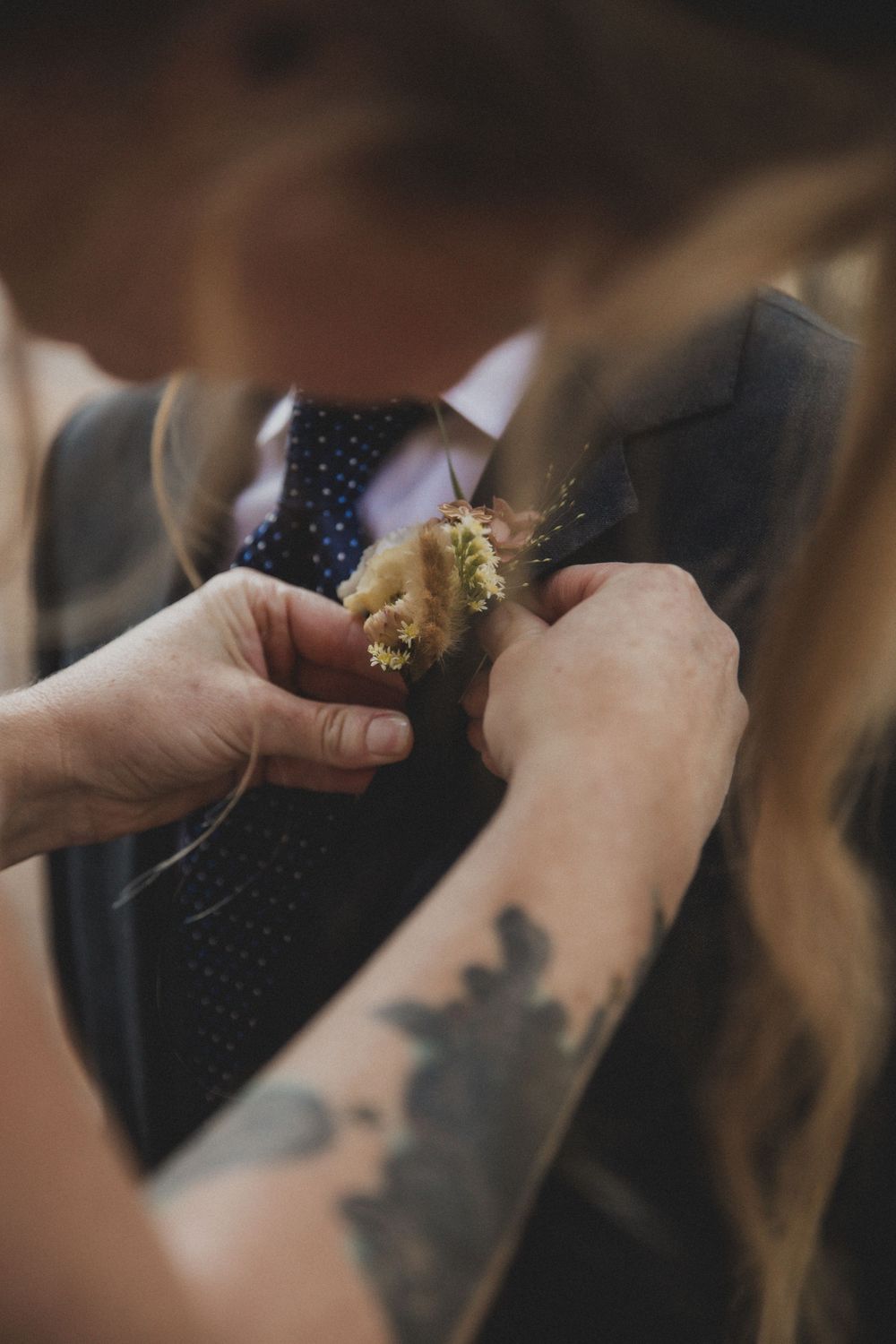 Close-up of hands holding and preparing something delicate.