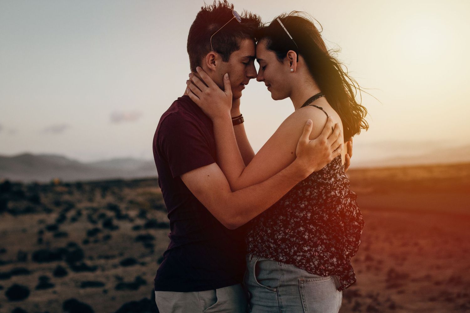 Couple embracing at sunset in the volcanic landscape - Wedding and couple photographer in Fuerteventura and Lanzarote photoFuerte