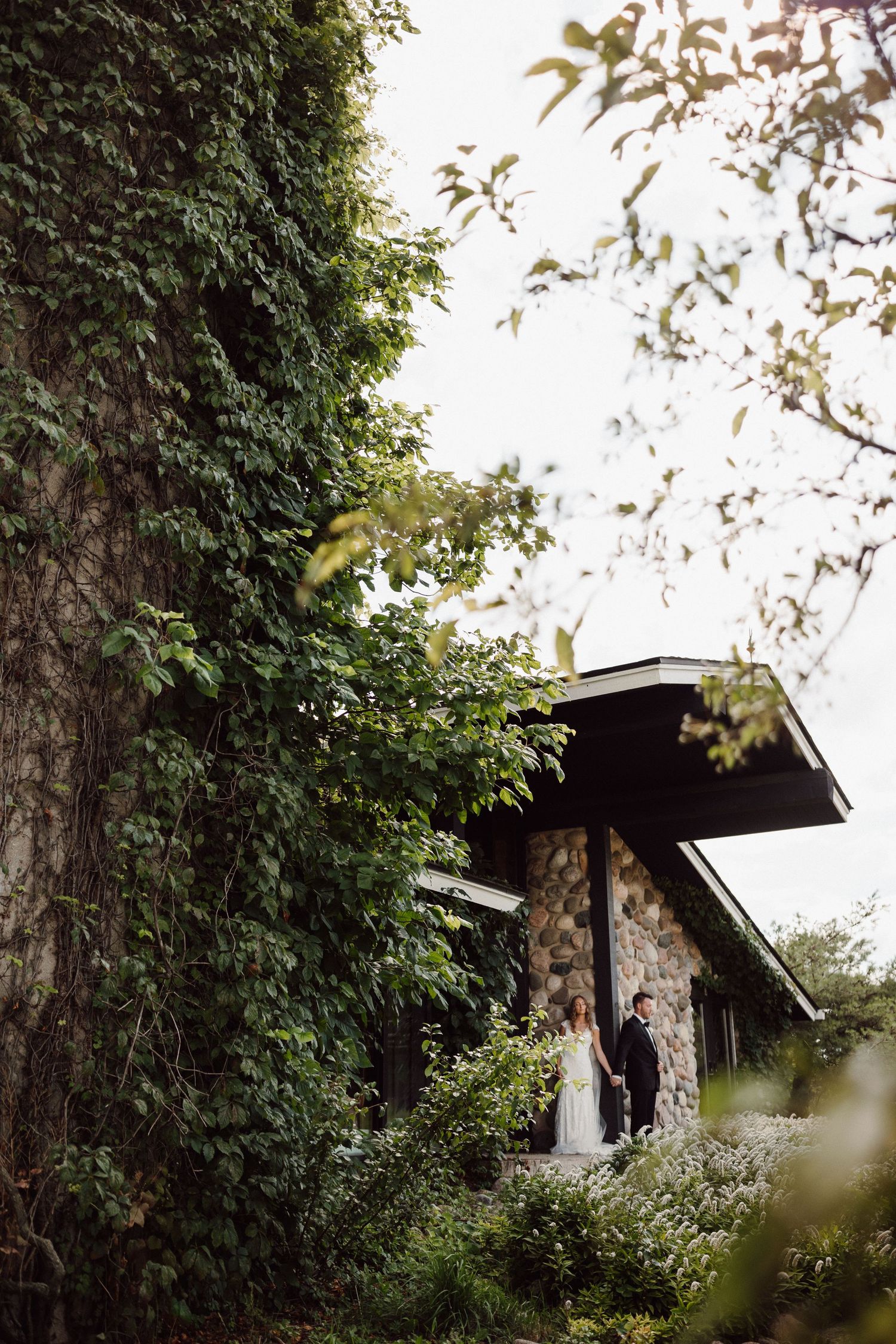 Exterior shots of an ivy-covered building with dark architectural details.