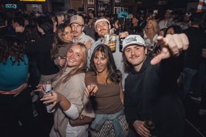 Group of party-goers enjoying themselves at a nightclub event. live event photography st louis