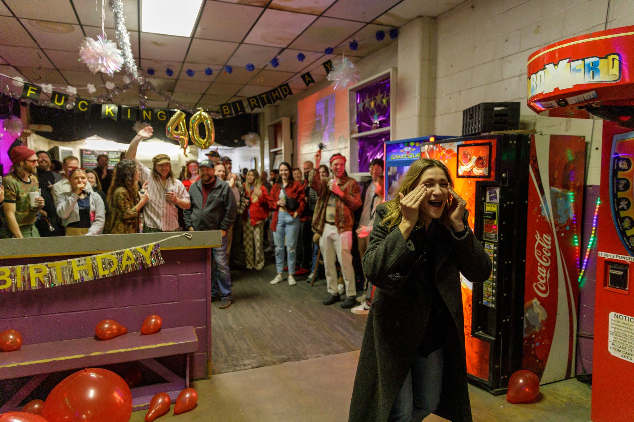 Birthday party celebration in retro arcade room with vintage games and decorations. photography st louis.
