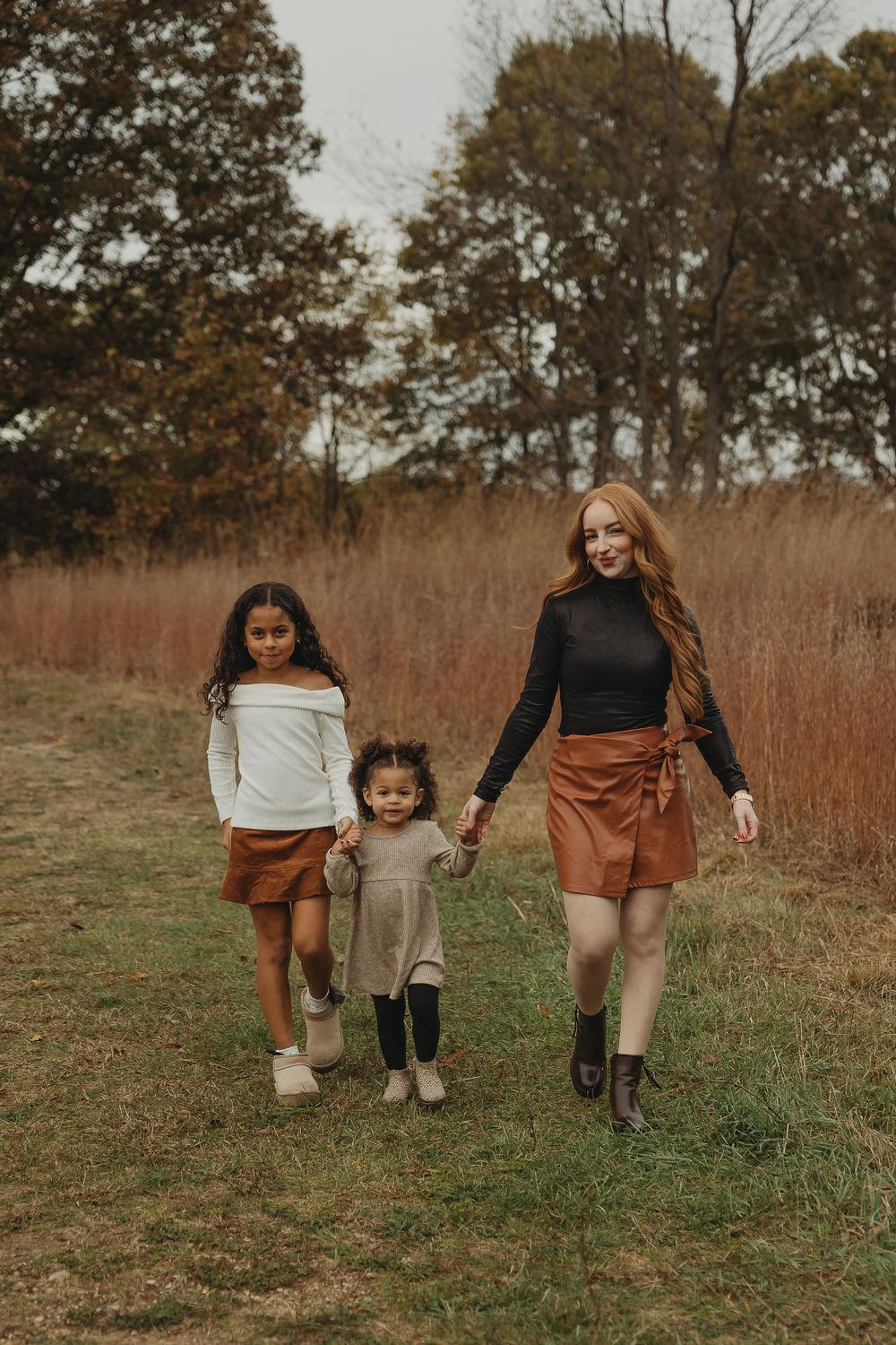 A series of candid photos showing people walking through a field of tall autumn grass on an overcast day.