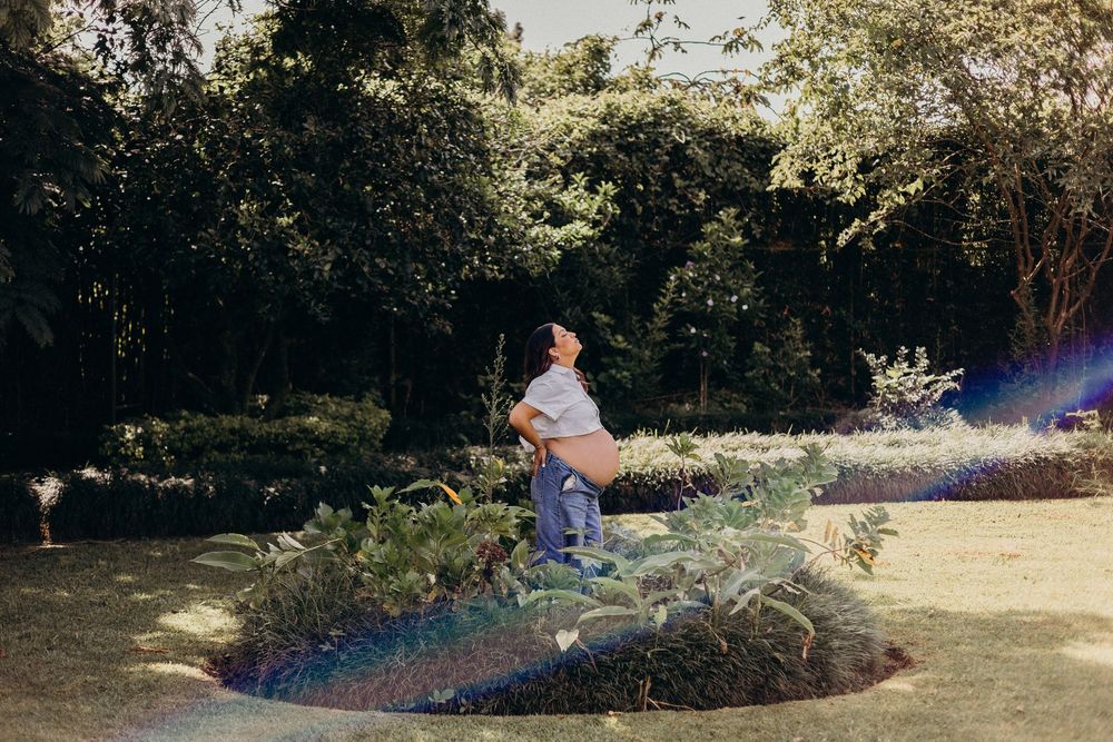 A romantic couple's photoshoot sequence captured in a sunny outdoor garden setting.