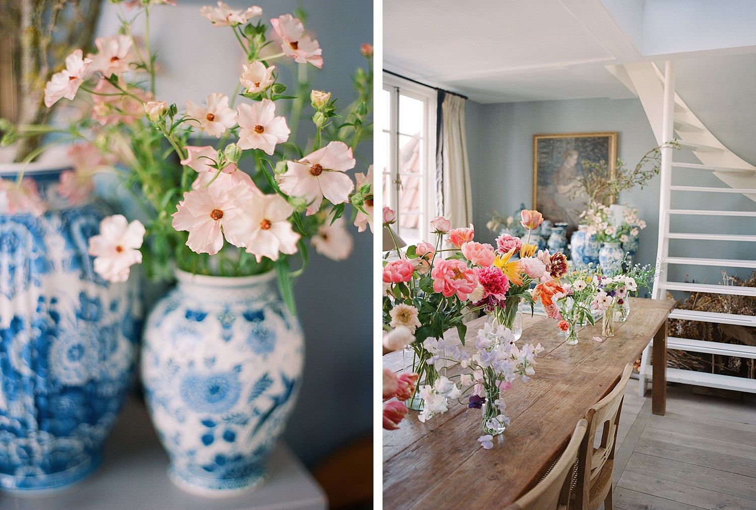 Pink flowers arranged in blue and white chinoiserie vases beside a rustic dining table with floral centerpieces.