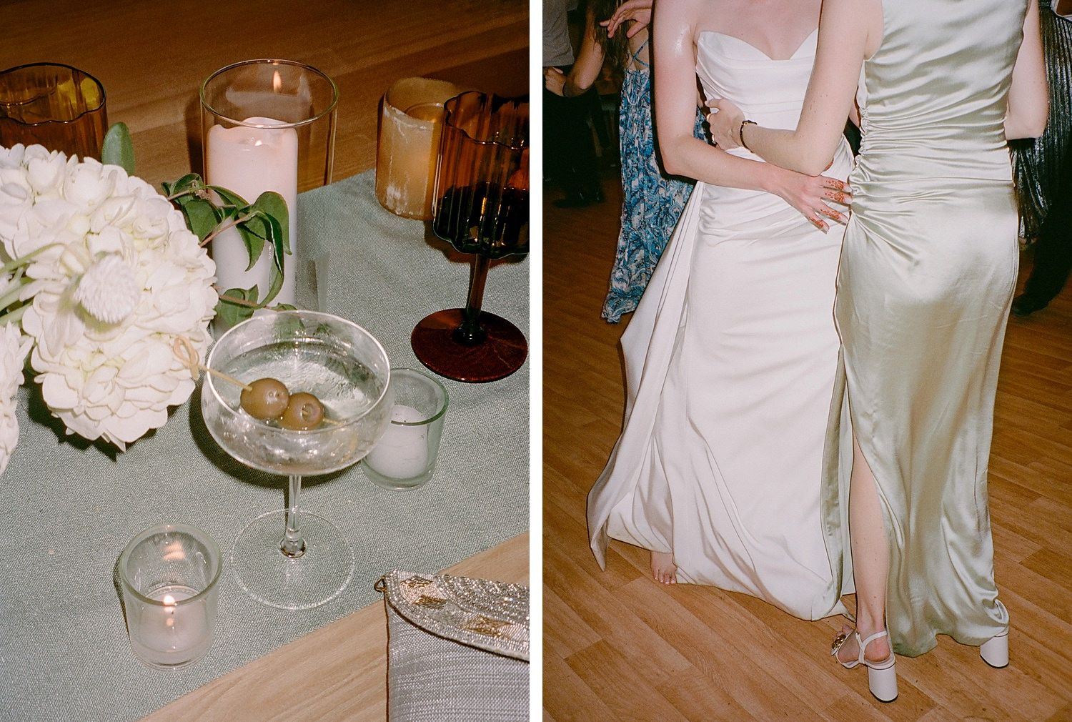 A wedding reception table with white peonies and wine glasses next to elegant white gowns on a wooden dance floor.